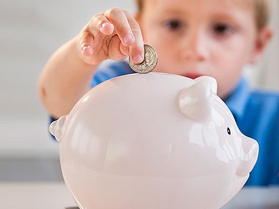 boy-with-piggy-bank-teaching-kids-about-money-pg-full